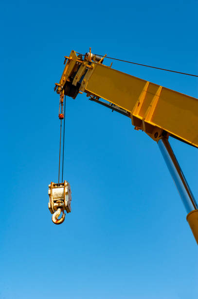 Crane Crane aganist the blue sky jib stock pictures, royalty-free photos & images