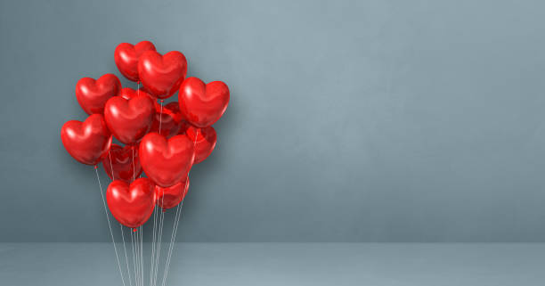 istock Red heart shape balloons bunch on a grey wall background. Horizontal banner. 1313592730