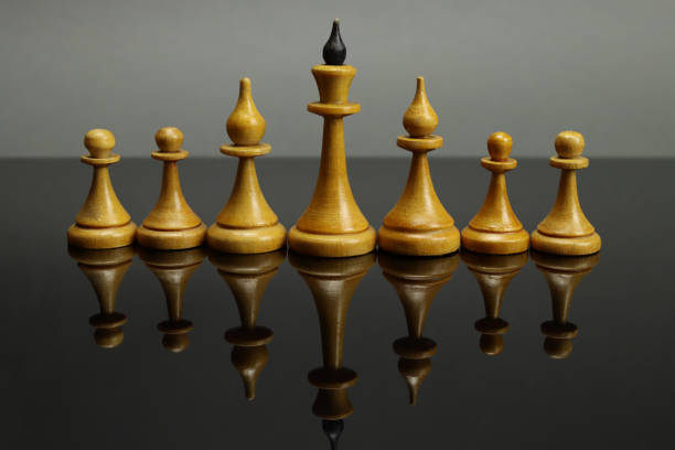 istock Vintage chess on a mirror surface, business leadership concept 1313593375