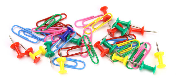 istock colored stationery buttons and paper clips isolated on white 1313593474