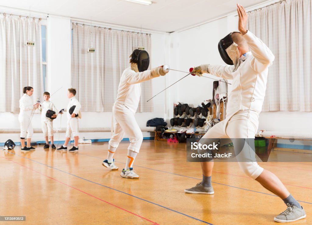 Fencing Training Roon Serious Group Practicing Fencing Techniques Stock Photo - Download ...