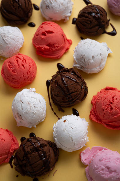 istock Various gelato scoops with chocolate sauce close up on golden surface 1313593614