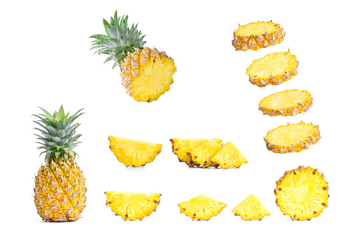 Collection of sliced pineapples and pineapple isolated on white background.