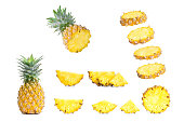 Collection of sliced pineapples isolated on white background.