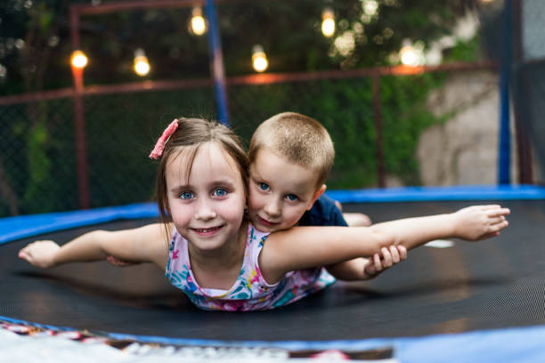istock Playful children in trampoline 1313596920