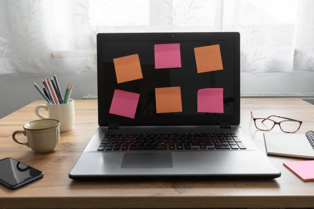 istock A laptop with colorful sticky notes on a home desk 1313597070