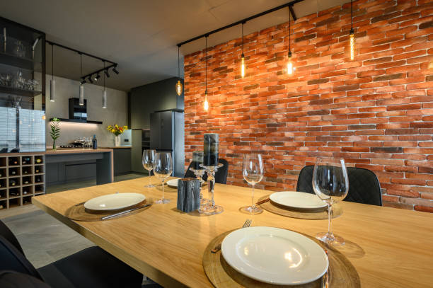 istock Modern luxurious dark gray and black kitchen with dining table 1313599174