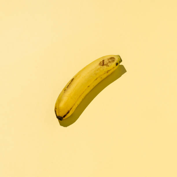 istock A banana on a yellow background. 1313600177
