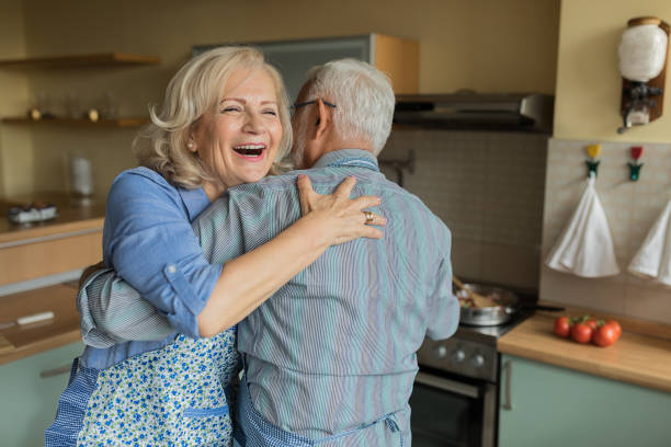 istock Elderly Couple Enjoying in Dance While Cooking at Home. 1313602236