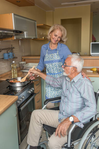 istock Older Couple is Enjoying at Home while Preparing a Delicious Meal. 1313602501