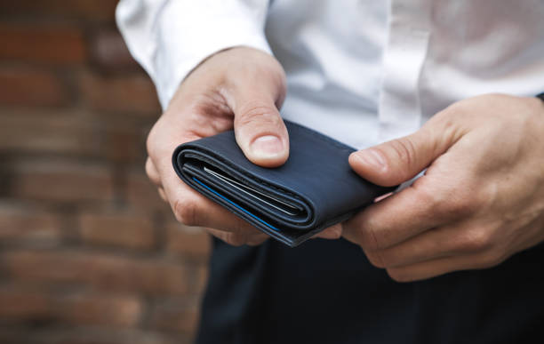 istock A businessman holds a wallet in his hands 1313604688