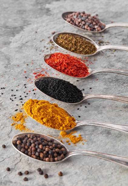 istock Black cumin and other spices in spoons 1313605956