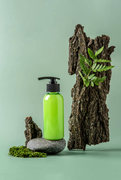 istock Bottle with dispenser on stone podium and pastel background. Cosmetic container mockup with place for text. Natural skincare beauty product concept. 1313607285