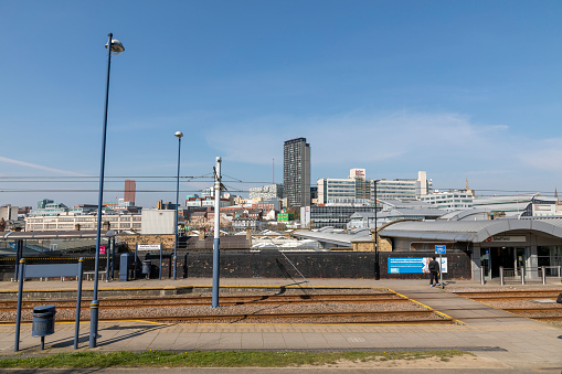 Sheffield, South Yorkshire, England - April 17 2021: Sheffield Supertrram  with the city in the background