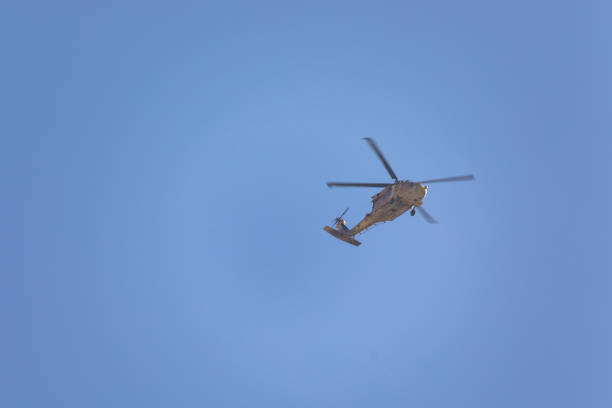 Military helicopter at far distance in the sky