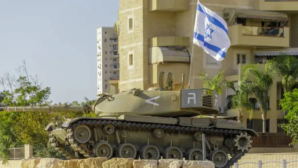 Photo of The monument of tank on a pedestal in the center of the crossroad