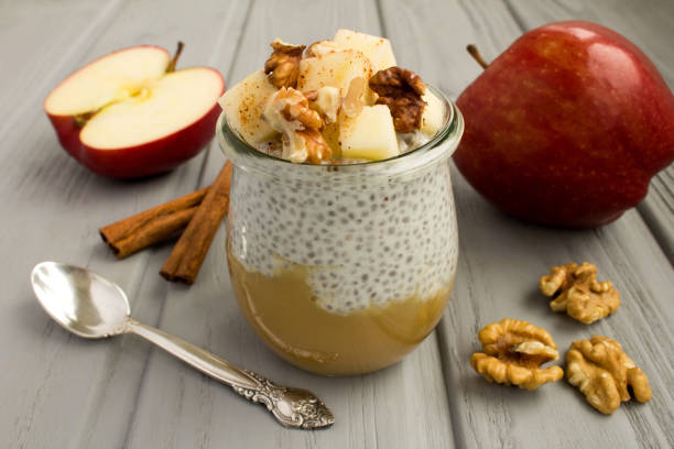 istock Pudding with chia seed, apples,cinnamon and walnuts  on the gray wooden background 1313609134