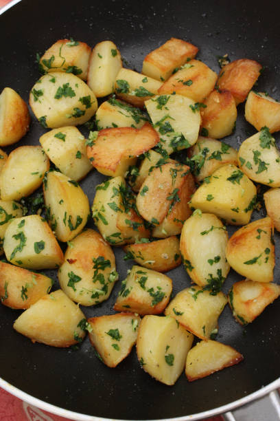 istock Sauteed potatoes with minced garlic and parsley 1313611699