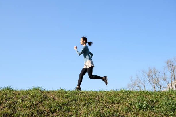 istock Woman running on riverbank 1313614854