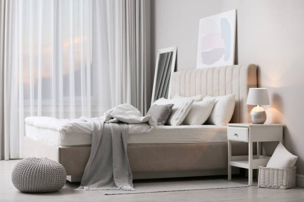 istock Stylish room interior with large comfortable bed 1313615740