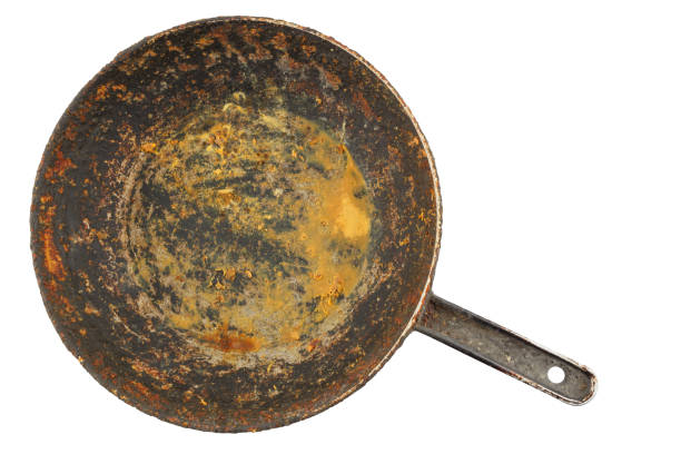 istock old disgusting stained rusty cast iron pan with burnt fat and food leftovers isolated in directly above perspective 1313616146