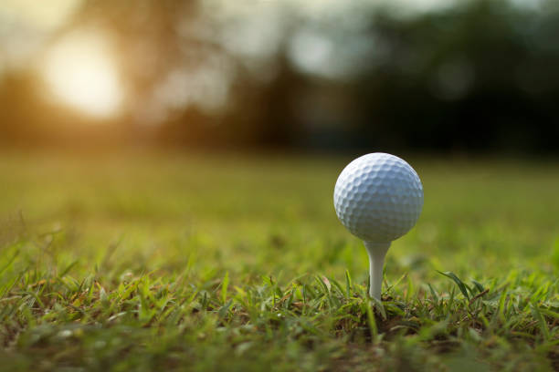 istock golf ball on tee in a beautiful golf course with morning sunshine 1313617000