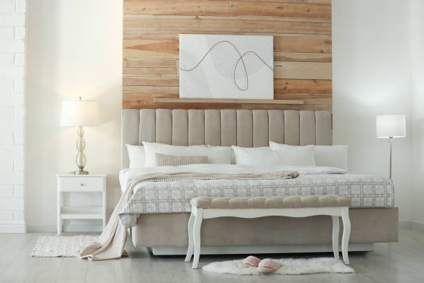 istock Stylish room interior with large comfortable bed 1313617079