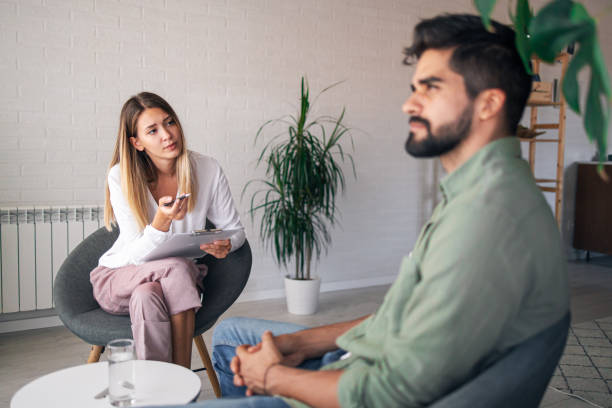 istock Professional handsome psychologist trying to help her patient 1313617265