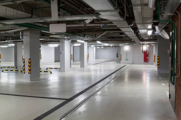 istock Empty parking garage underground interior in apartment or in supermarket 1313619948