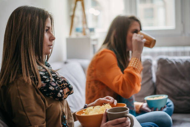 istock Twins watching film 1313621232