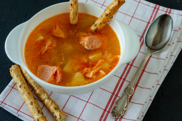 istock homemade soup with salmon with bread sticks on back concrete background 1313624279