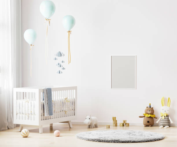 istock Blank poster frame mock up on white wall in nursery room interior background with baby bedding, soft toys, balloons, 3d rendering 1313628234