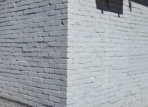 House corner, Brick wall painted with white paint.