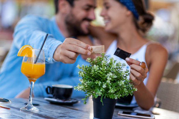istock Young couple drink coffee in cafe 1313630511