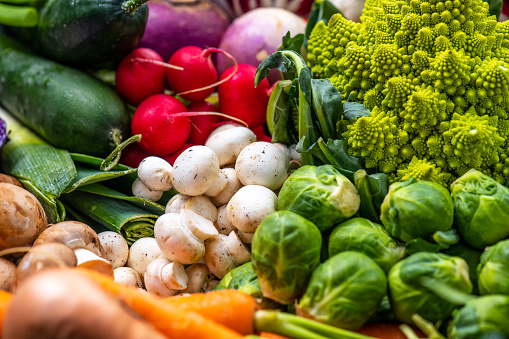 Close-up of fresh vegetables romanesco cauliflower, mushroom, turnip, cabbage and carrot.