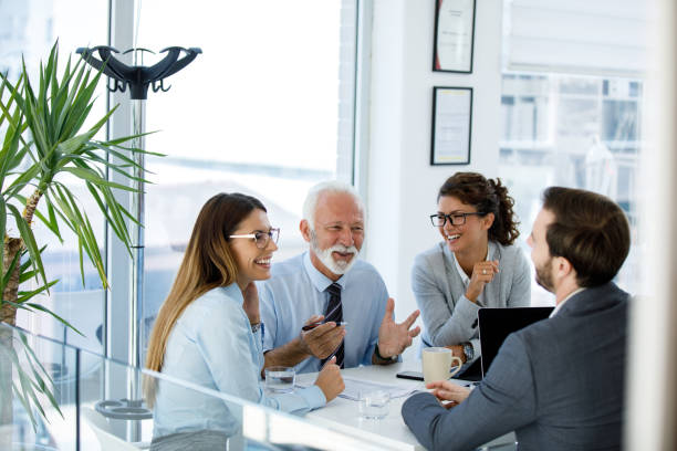 istock Young business people cooperating with experienced colleague 1313631794