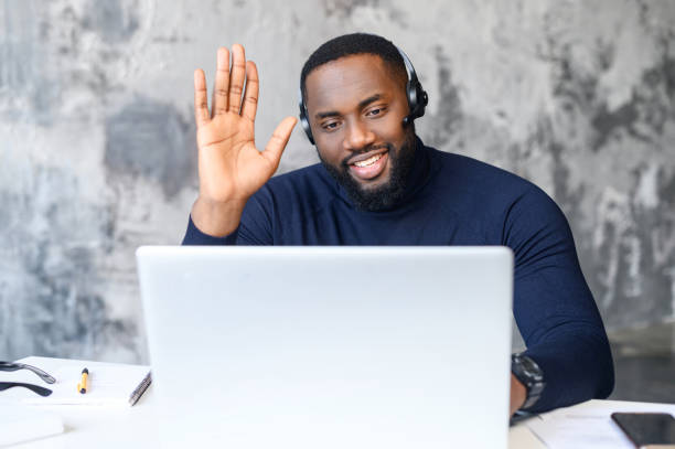 istock Black businessman making video call sitting with headset 1313631922