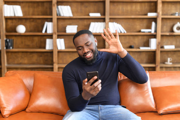 istock African American man talking using app on smartphone 1313632331
