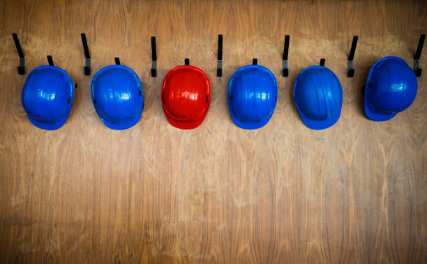 istock Set of protective helmets hanging on the hanger 1313634831