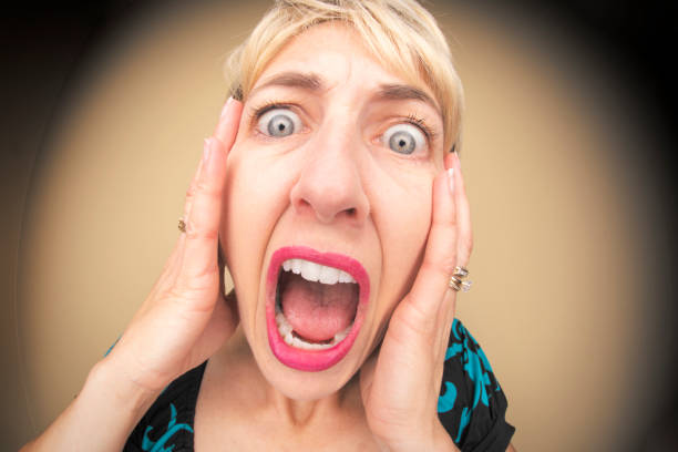 A humorous fisheye image of a screaming woman.