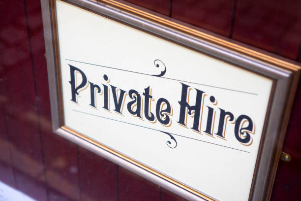 Private Hire notice in a picture frame in a window