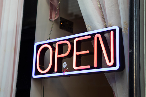 Open sign in illuminated neon lettering