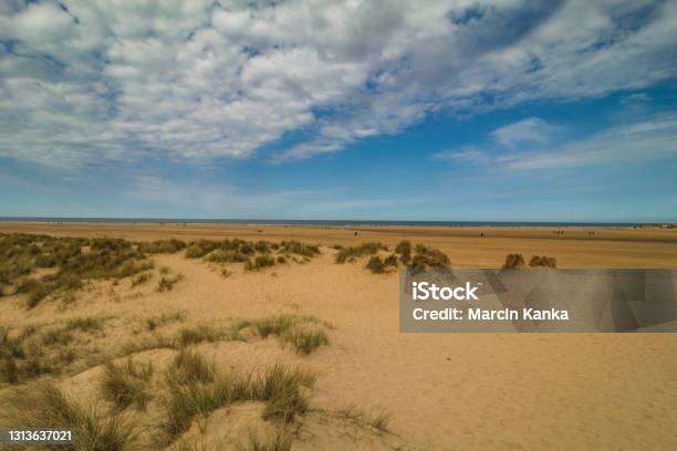 Walking On The Beach In England Holkland Beach North Sea Stock Photo - Download Image Now