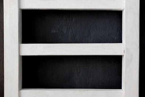 istock White wooden frame on a black background 1313639887