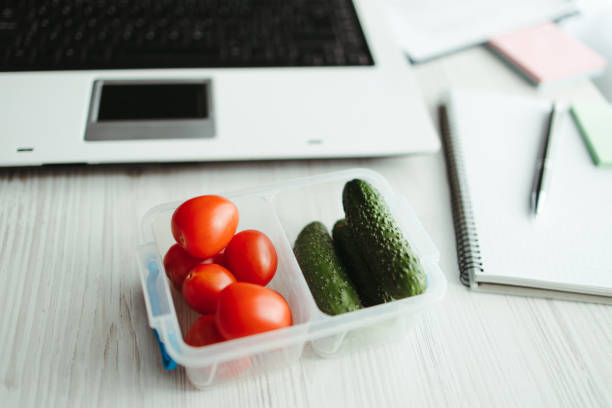 istock Healthy snack at office, lunch box with vegetables 1313641557