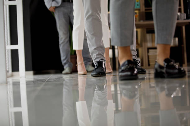 istock Group of unrecognizable people standing in row and waiting 1313643042