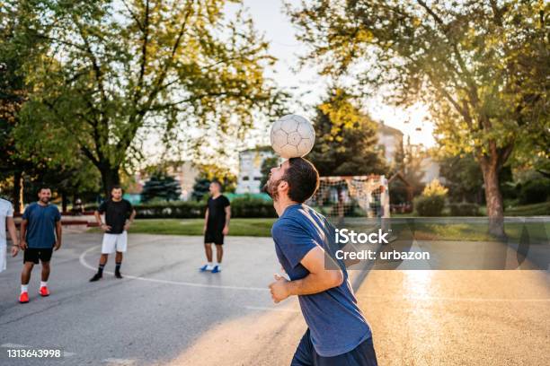Man Juggling Soccer Ball With Head Stock Photo - Download Image Now - Soccer, Juggling, Soccer Ball