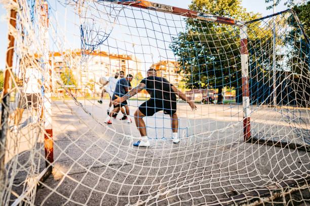 istock Goalkeeper defending goal in soccer game 1313644042