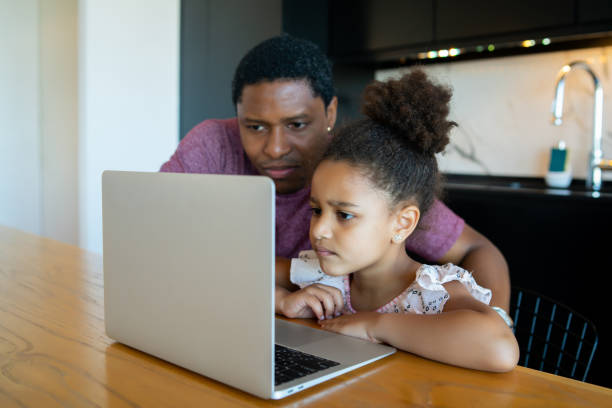istock A father helping his daughter with homeschool. 1313644163