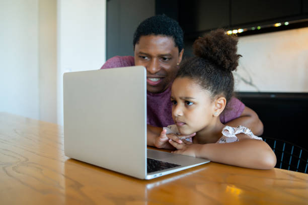istock A father helping his daughter with homeschool. 1313644165